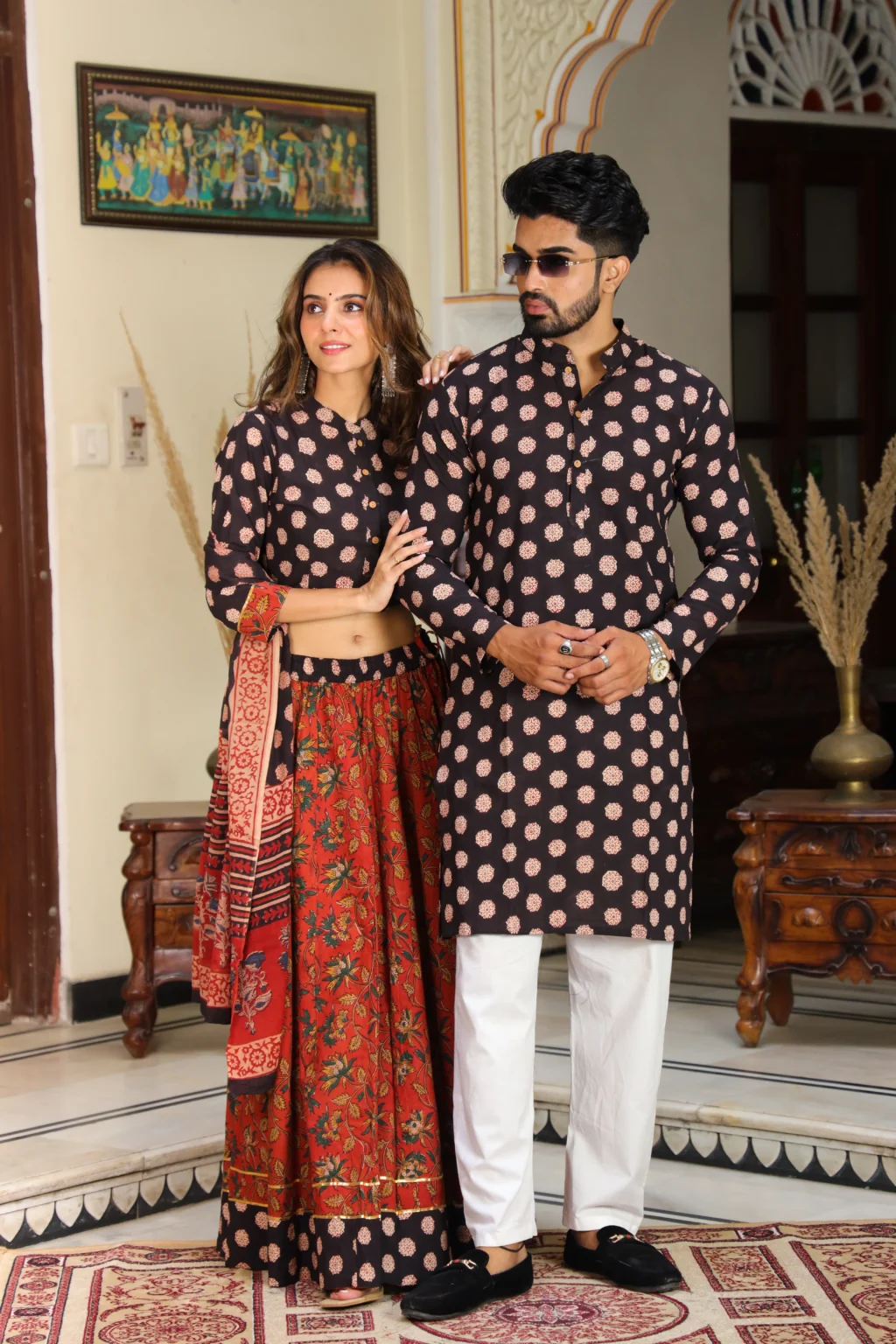 red-black lehenga choli couple side view